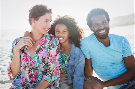 simsearch:6113-06498556,k - Portrait smiling, multi-ethnic family on sunny summer beach Stock Photo - Premium Royalty-Free, Code: 6113-09027674