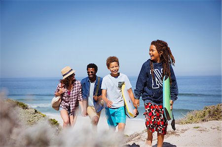 simsearch:649-06717264,k - Multi-ethnic family walking with boogie boards on sunny summer ocean beach Stock Photo - Premium Royalty-Free, Code: 6113-09027687