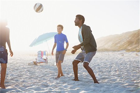 simsearch:649-08004031,k - Father and children playing soccer on sunny summer beach Stock Photo - Premium Royalty-Free, Code: 6113-09027690