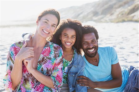 simsearch:632-05845211,k - Portrait smiling, affectionate multi-ethnic family on sunny summer beach Stock Photo - Premium Royalty-Free, Code: 6113-09027758
