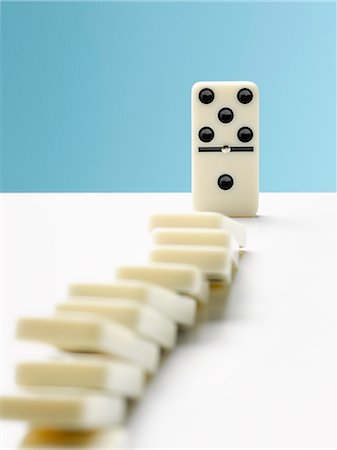 simsearch:6113-07589120,k - Domino toppling row of dominos Stock Photo - Premium Royalty-Free, Code: 6113-09027829