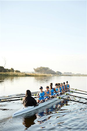 simsearch:700-01633002,k - Female rowers rowing scull on sunny lake Stock Photo - Premium Royalty-Free, Code: 6113-09144555