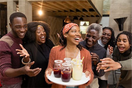 Happy multi-generation family enjoying lemonade and sangria on patio Stock Photo - Premium Royalty-Free, Code: 6113-09144570