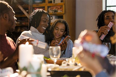 simsearch:6113-08743448,k - Mother and daughter using smart phone at Christmas dinner Stock Photo - Premium Royalty-Free, Code: 6113-09144579