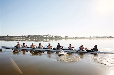 simsearch:700-01633002,k - Female rowing team rowing scull on sunny lake Stock Photo - Premium Royalty-Free, Code: 6113-09144521