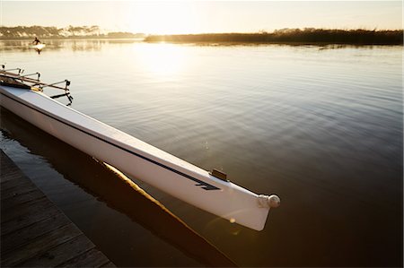 sports and rowing - Scull at dock on tranquil sunrise lake Stock Photo - Premium Royalty-Free, Code: 6113-09144525