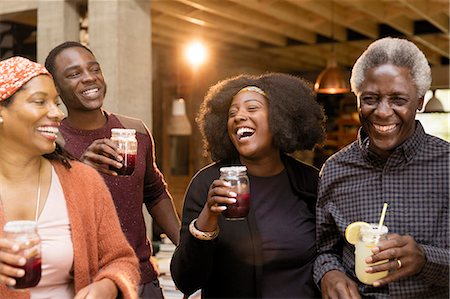 Happy multi-generation family drinking lemonade and sangria Stock Photo - Premium Royalty-Free, Code: 6113-09144671