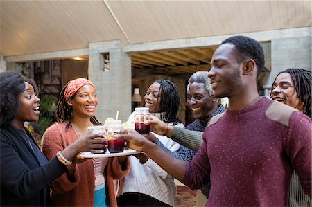 simsearch:6113-07242379,k - Multi-generation family enjoying sangria on patio Stock Photo - Premium Royalty-Free, Code: 6113-09144625