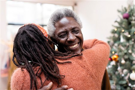 simsearch:649-06716867,k - Happy senior couple hugging near Christmas tree Stock Photo - Premium Royalty-Free, Code: 6113-09144631