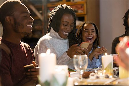 simsearch:6113-07730567,k - Happy mother and daughter with smart phone at Christmas dinner Stock Photo - Premium Royalty-Free, Code: 6113-09144639