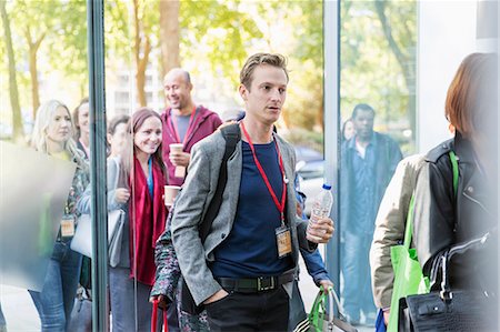 simsearch:614-00657328,k - Business people arriving at conference, entering doorway Stock Photo - Premium Royalty-Free, Code: 6113-09157422