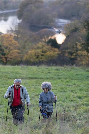 simsearch:400-04035087,k - Active senior couple hiking up rural hillside Stock Photo - Premium Royalty-Free, Code: 6113-09157557