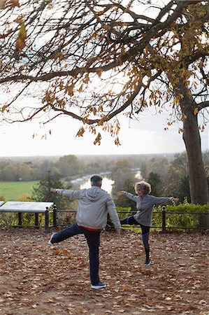 simsearch:400-04035087,k - Active senior couple exercising, stretching in autumn park Stock Photo - Premium Royalty-Free, Code: 6113-09157567