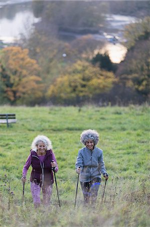 simsearch:6122-07699789,k - Active senior women friends hiking with poles up rural hillside Stock Photo - Premium Royalty-Free, Code: 6113-09157579