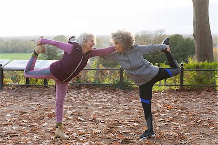 simsearch:693-06018275,k - Active senior women friends stretching in autumn park Stock Photo - Premium Royalty-Free, Code: 6113-09157587