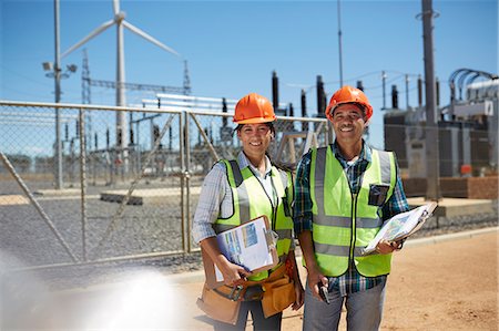 simsearch:6113-07160283,k - Portrait smiling, confident engineers with clipboards at power plant Stock Photo - Premium Royalty-Free, Code: 6113-09157842