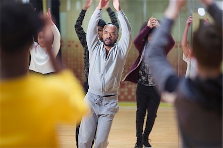 simsearch:649-07063753,k - Focused male instructor leading dance class in studio Stock Photo - Premium Royalty-Free, Code: 6113-09157861