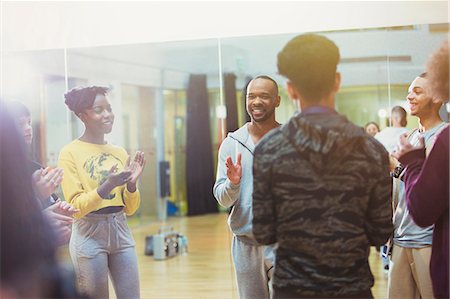 simsearch:649-07063753,k - Students clapping for male instructor in dance class studio Stock Photo - Premium Royalty-Free, Code: 6113-09157890