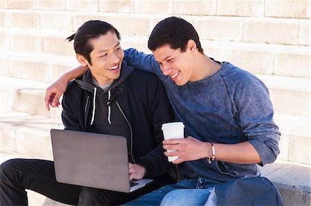 simsearch:6113-06753677,k - Male gay couple using laptop and drinking coffee Stock Photo - Premium Royalty-Free, Code: 6113-09168375