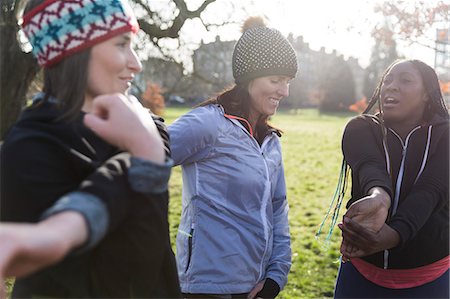 simsearch:6124-08820833,k - Female runners stretching in sunny park Stock Photo - Premium Royalty-Free, Code: 6113-09168306