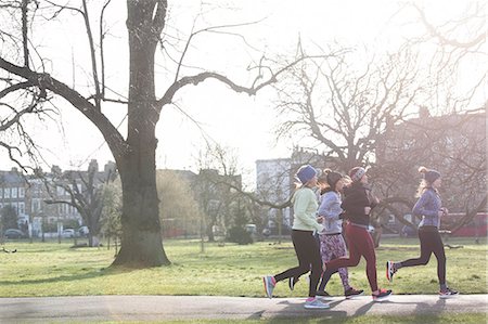 simsearch:628-05817723,k - Female runners running in sunny park Stock Photo - Premium Royalty-Free, Code: 6113-09168329