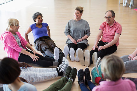 southeast - Instructor and active seniors stretching legs in circle in exercise class Stock Photo - Premium Royalty-Free, Code: 6113-09178621