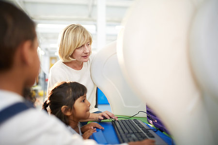 simsearch:6113-07589120,k - Teacher and schoolgirl using computer in science center Stock Photo - Premium Royalty-Free, Code: 6113-09178892