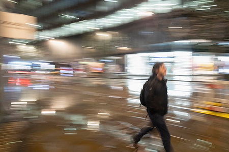 Man walking on urban street at night Stock Photo - Premium Royalty-Free, Code: 6113-09178805
