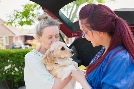 simsearch:6113-06720867,k - Lesbian couple and dog in driveway Stock Photo - Premium Royalty-Free, Code: 6113-09191927