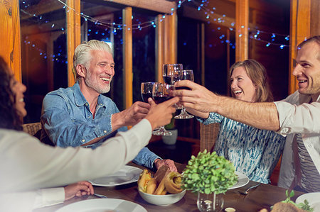 simsearch:6113-08659553,k - Friends celebrating, drinking red wine and enjoying dinner in cabin Stock Photo - Premium Royalty-Free, Code: 6113-09192077