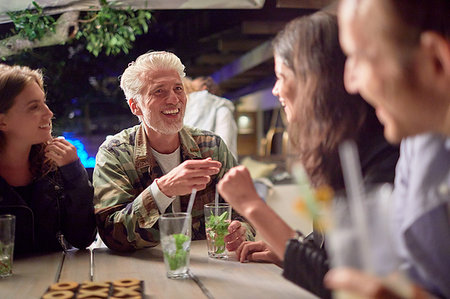 Friends drinking on patio Stock Photo - Premium Royalty-Free, Code: 6113-09192087