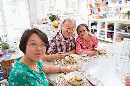 simsearch:6116-07235720,k - Portrait happy multi-generation family eating noodles with chopsticks at table Stock Photo - Premium Royalty-Free, Code: 6113-09199947