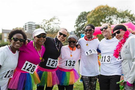 simsearch:6113-07148073,k - Portrait smiling runners in tutus at charity race in park Stock Photo - Premium Royalty-Free, Code: 6113-09131342