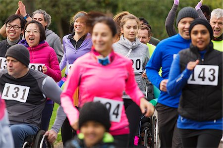 Crowd of runners running at charity run Stock Photo - Premium Royalty-Free, Code: 6113-09131394