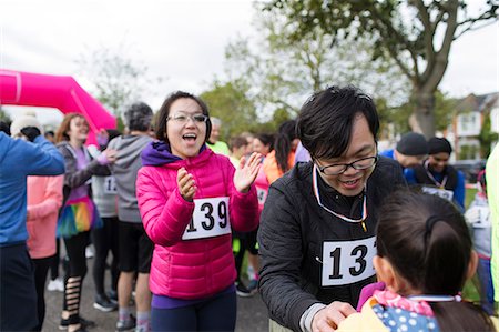 fitness asian couple - Family runners at charity run in park Stock Photo - Premium Royalty-Free, Code: 6113-09131316