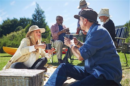 Active senior friends enjoying sunny summer picnic Stock Photo - Premium Royalty-Free, Code: 6113-09131470