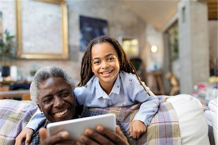 simsearch:6113-06908842,k - Portrait smiling grandfather and granddaughter with digital tablet Stock Photo - Premium Royalty-Free, Code: 6113-09131546