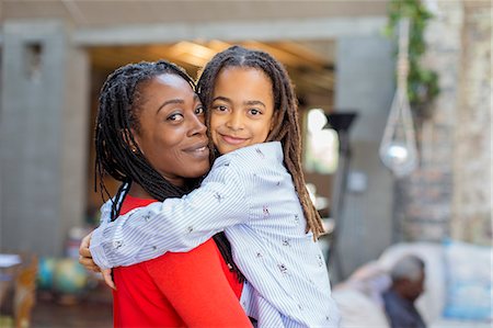 simsearch:6113-07543218,k - Portrait smiling mother and daughter hugging Stock Photo - Premium Royalty-Free, Code: 6113-09131569
