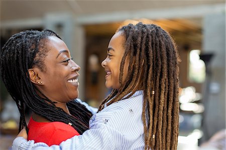 simsearch:6113-07543218,k - Happy mother and daughter hugging face to face Stock Photo - Premium Royalty-Free, Code: 6113-09131574