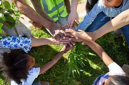 simsearch:859-06808649,k - Volunteers joining hands, planting trees in park Stock Photo - Premium Royalty-Free, Code: 6113-09240205