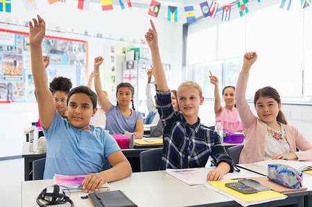 simsearch:649-07280058,k - Eager junior high school students with hands raised in classroom Stock Photo - Premium Royalty-Free, Code: 6113-09240392
