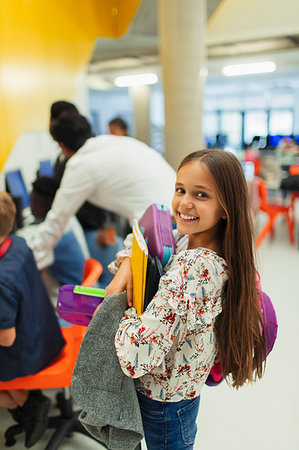 simsearch:614-06895765,k - Portrait smiling, confident junior high girl student carrying books Stock Photo - Premium Royalty-Free, Code: 6113-09240306