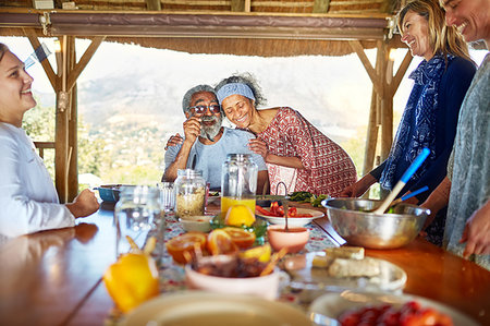 simsearch:6113-07242393,k - Couple hugging, enjoying healthy breakfast in hut during yoga retreat Stock Photo - Premium Royalty-Free, Code: 6113-09240488