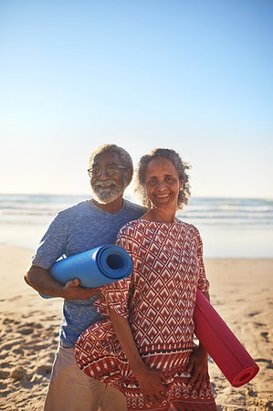 simsearch:649-07438003,k - Portrait happy senior couple with yoga mats on sunny beach Stock Photo - Premium Royalty-Free, Code: 6113-09240594