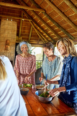 Women preparing healthy meal in hut during yoga retreat Stock Photo - Premium Royalty-Free, Code: 6113-09240510