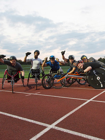 simsearch:6113-07588662,k - Portrait enthusiastic paraplegic athletes cheering, training for wheelchair race on sports track Stock Photo - Premium Royalty-Free, Code: 6113-09240727