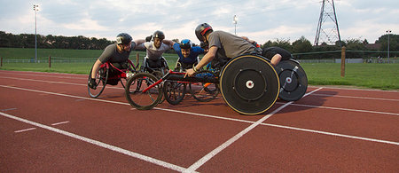 simsearch:700-00046258,k - Determined paraplegic athletes bonding in huddle, training for wheelchair race on sports track Stock Photo - Premium Royalty-Free, Code: 6113-09240730