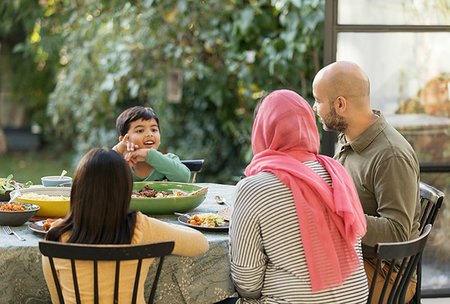 simsearch:614-06623604,k - Family eating dinner at table Stock Photo - Premium Royalty-Free, Code: 6113-09241052