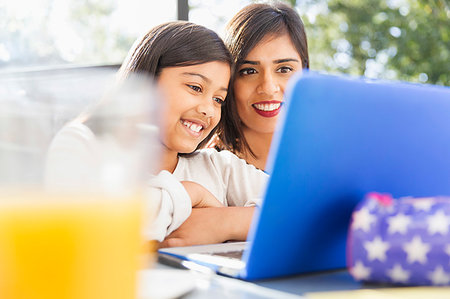 simsearch:400-05749563,k - Happy mother and daughter using laptop Stock Photo - Premium Royalty-Free, Code: 6113-09241073