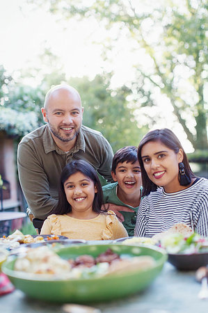 simsearch:614-06623604,k - Portrait happy family at dinner table Stock Photo - Premium Royalty-Free, Code: 6113-09241020